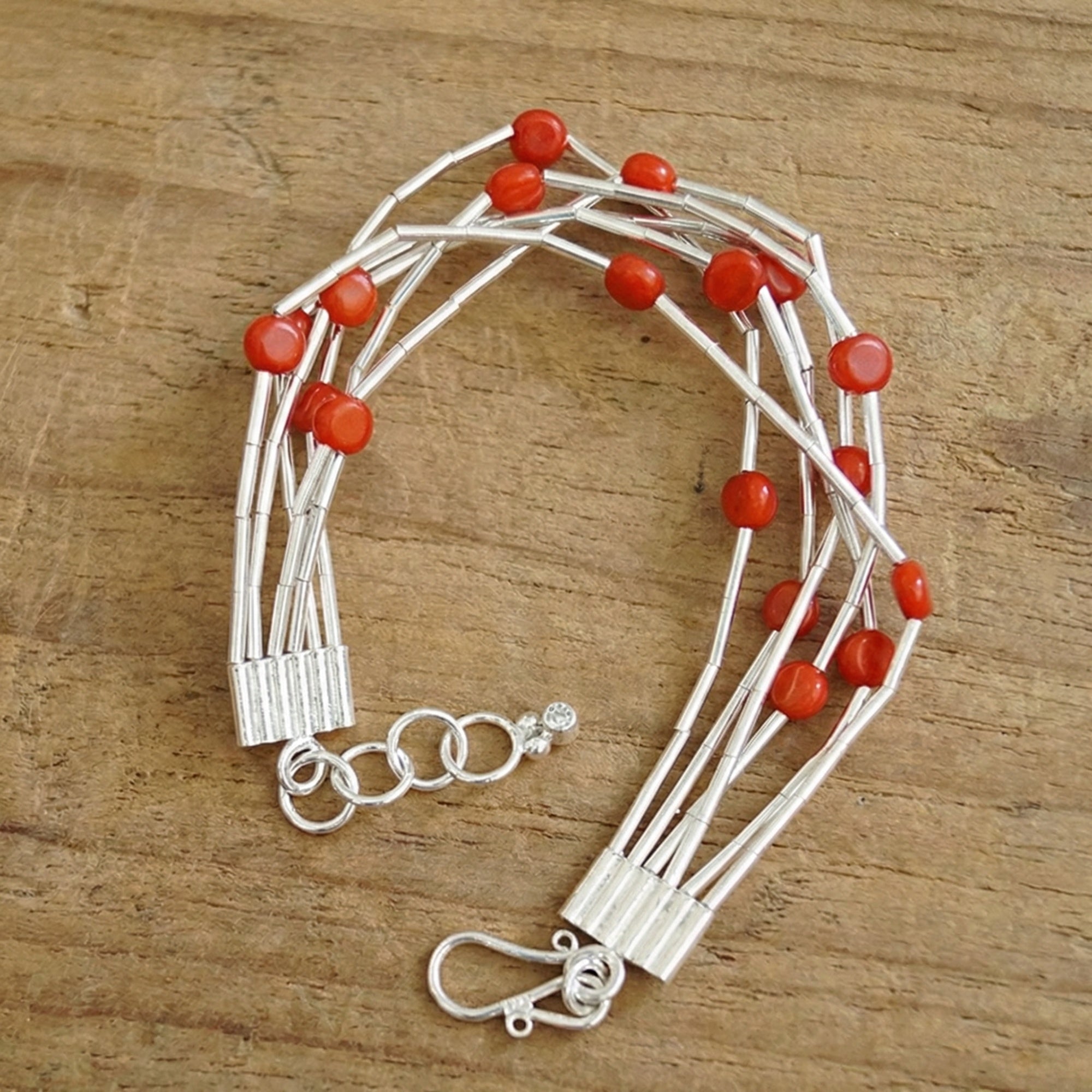 Full view of 6-strand red coral bracelet with silver clasp, 20cm length with extension, handmade by designer Sultan in Bodrum