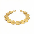 Handmade Ancient Troy disc bracelet in 925 sterling silver with gold plating, featuring 10mm circular discs .artisan jewelry by Sultan Bodrum