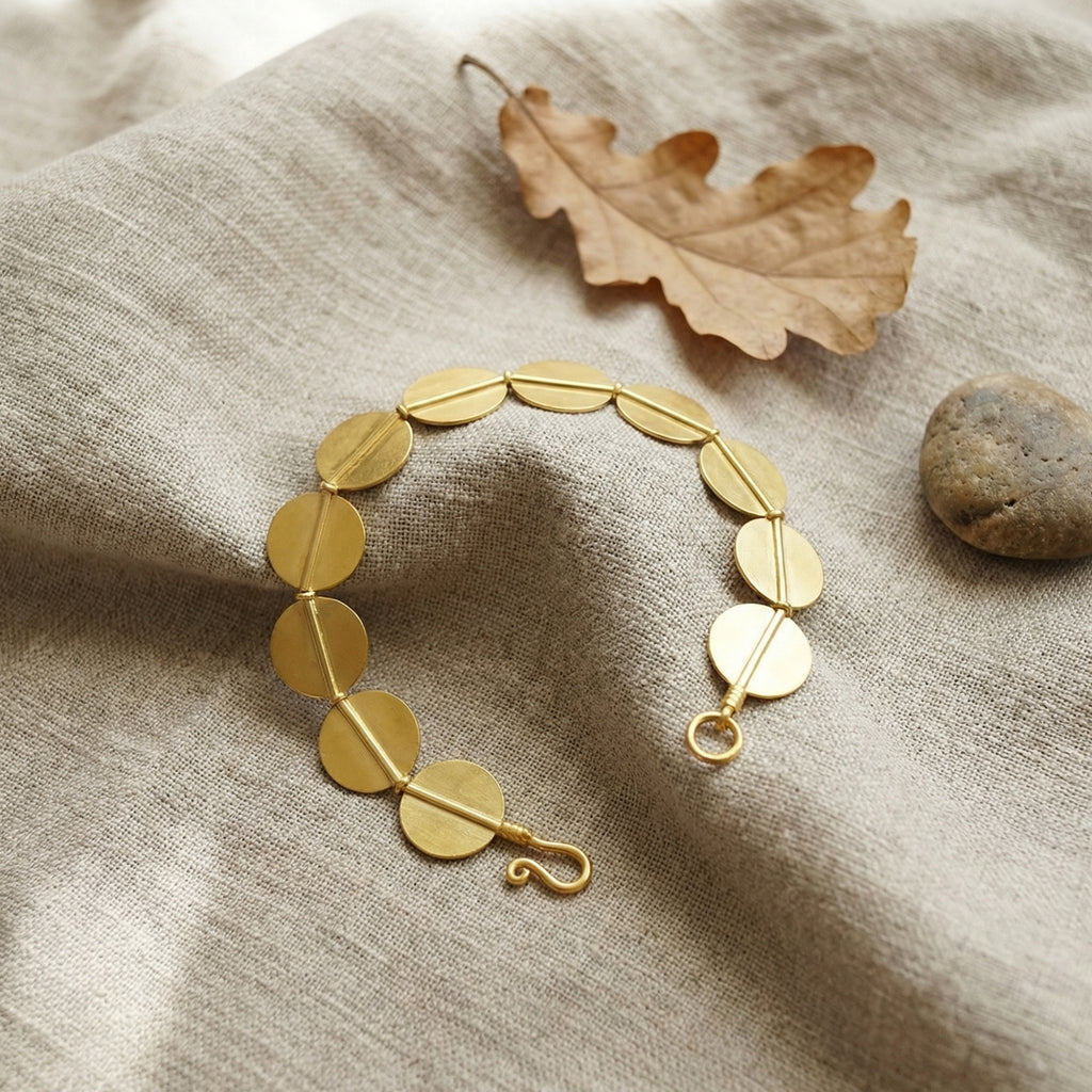 Ancient Troy heritage bracelet in 925 silver with optional gold plating, featuring circular discs symbolizing eternity, handcrafted artisan jewelry by Sultan