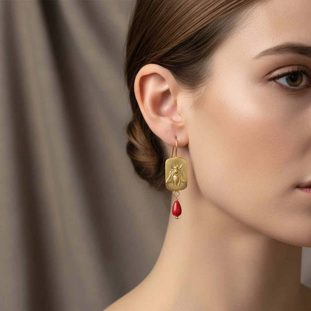 Turkish artisan bee coin earrings with coral charm showing detailed 24K gold plating, handcrafted in Bodrum atelier

