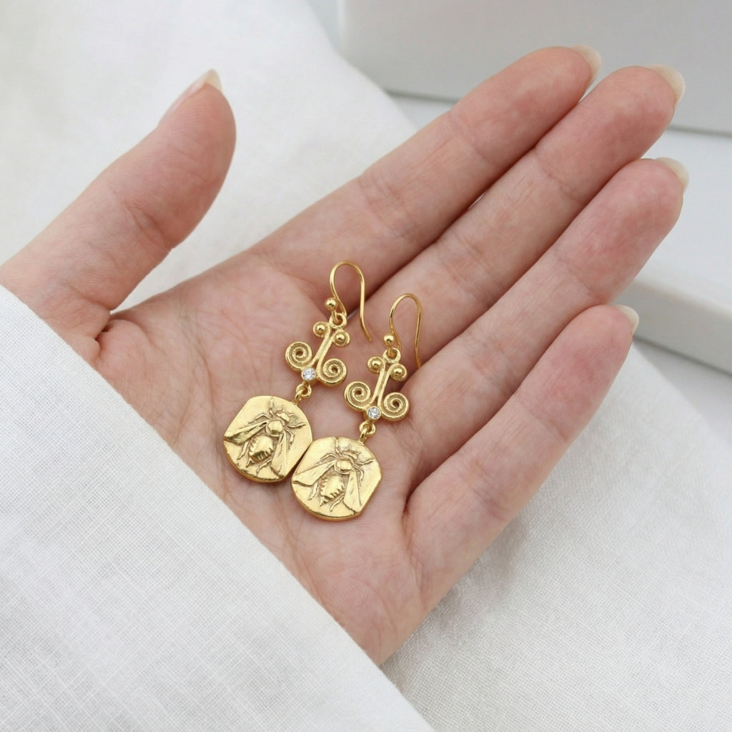 Artisan bee coin earring detail showing hammered texture and gold plating on sterling silver, handmade Turkish jewelry
