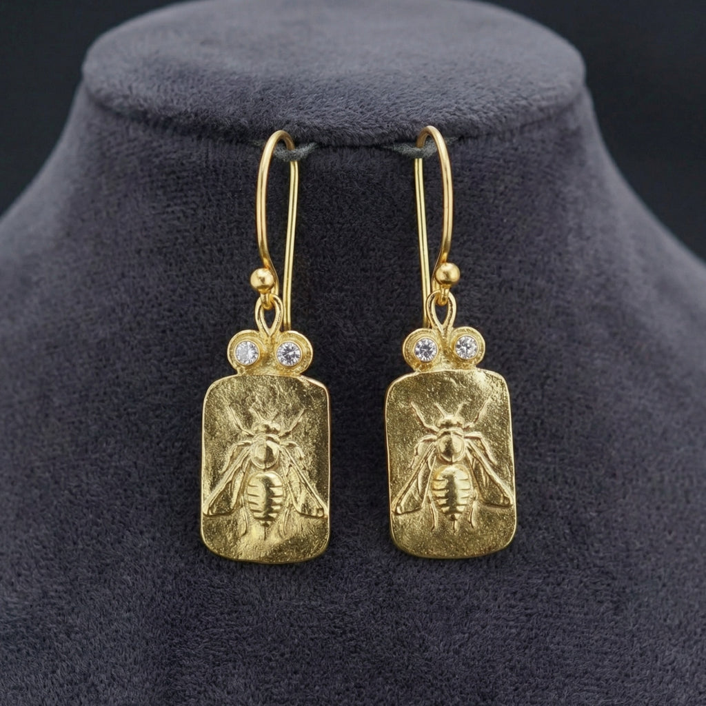 Gold bee coin earrings on model, 925 silver jewelry with ancient motif, perfect gift for women who love unique designer pieces
