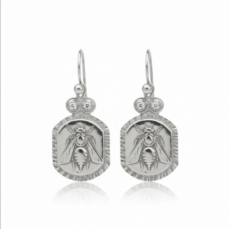 Designer gold bee earrings with white topaz inspired by ancient civilizations, handcrafted 925 silver jewelry from Bodrum workshop
