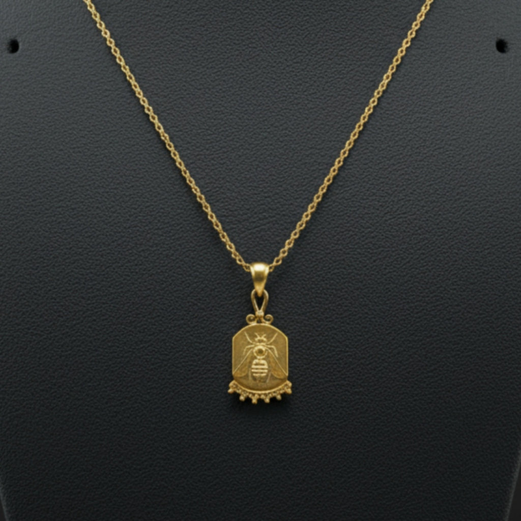 Gold bee coin necklace on model, 925 silver jewelry with ancient motif, perfect gift for women who love unique designer pieces
