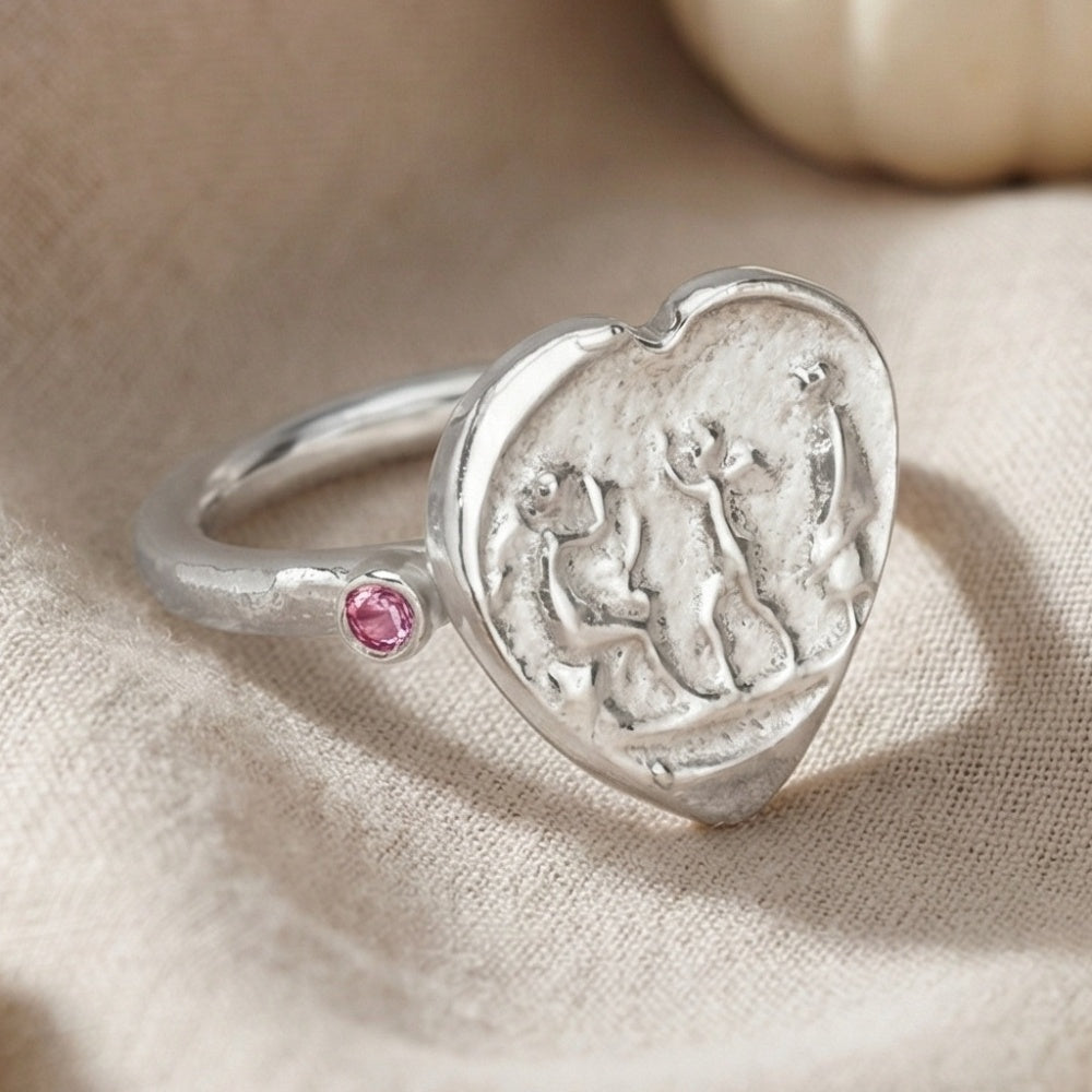 Close-up of pink topaz gemstone heart ring, handcrafted 925 silver jewelry from Bodrum