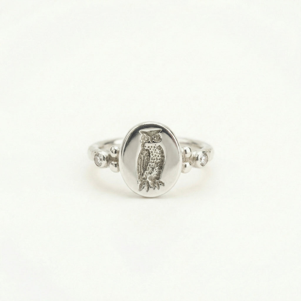 Hammered owl ring close-up showing ancient coin reproduction, handcrafted 925 silver artisan jewelry
