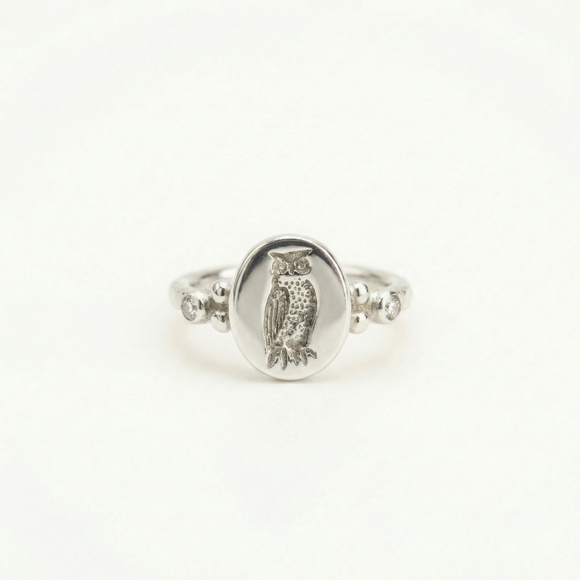 Hammered owl ring close-up showing ancient coin reproduction, handcrafted 925 silver artisan jewelry
