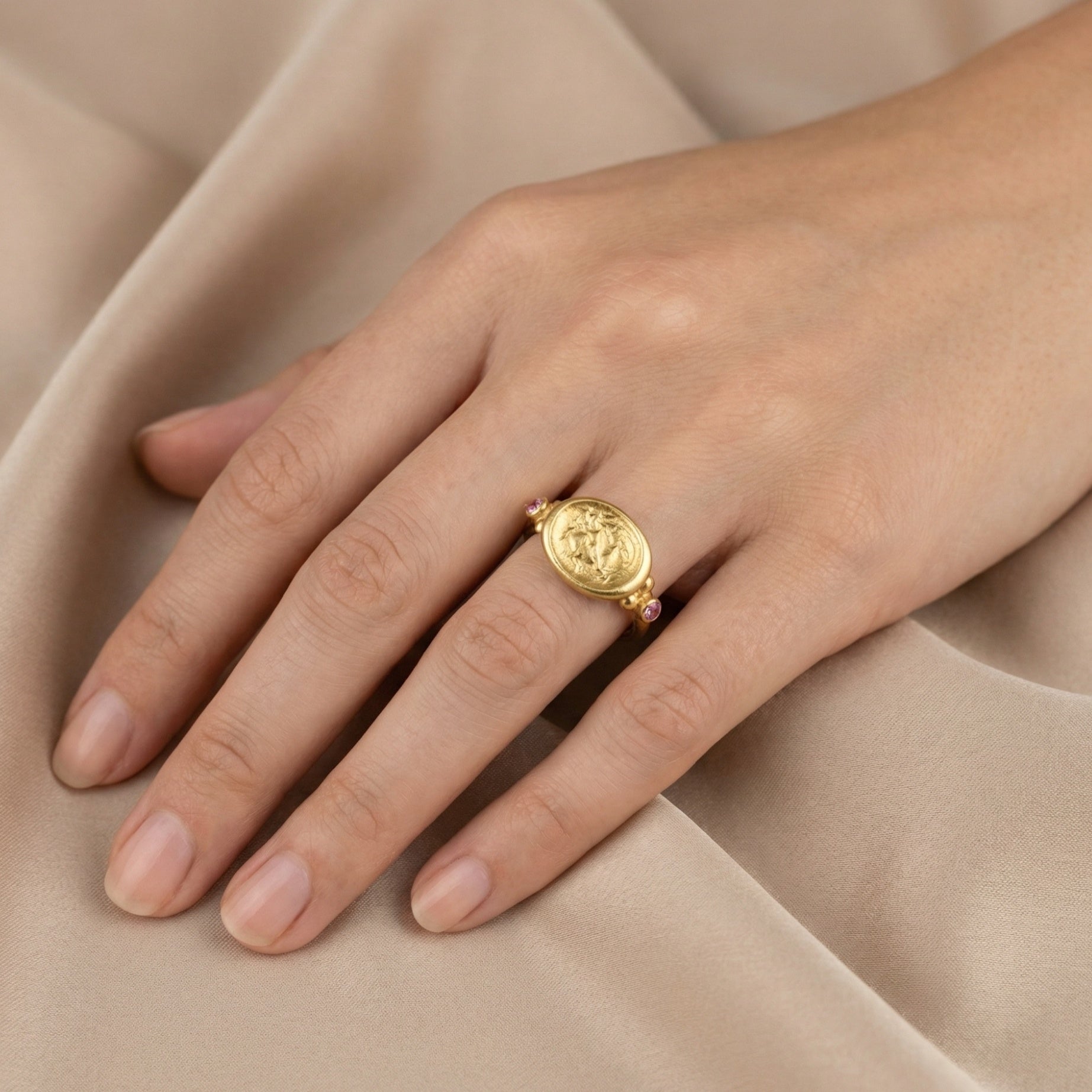 Close-up of purple amethyst stone set in gold-plated 925 silver ring, symbol of peace and tranquility