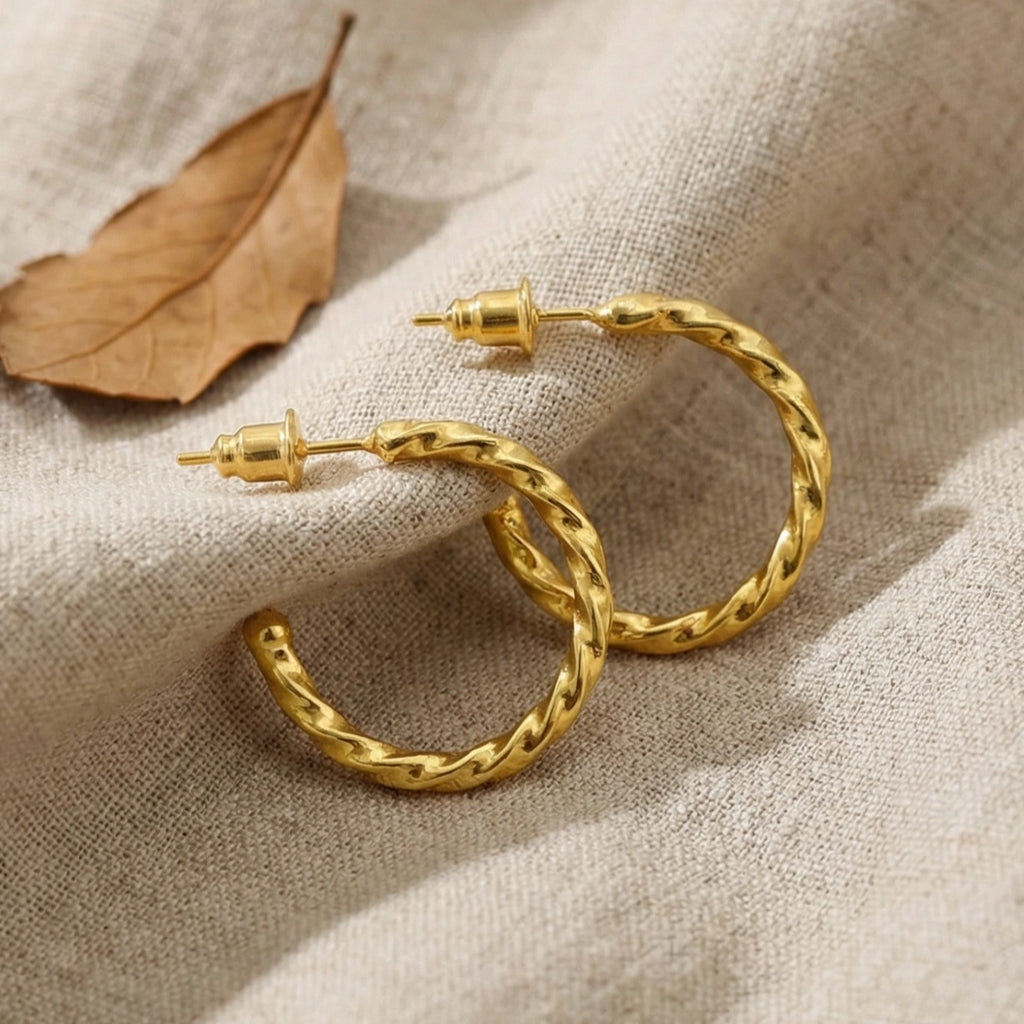 Large twisted hoop earrings in 925 sterling silver with gold plating, handcrafted Turkish artisan jewelry by designer Sultan Bodrum
