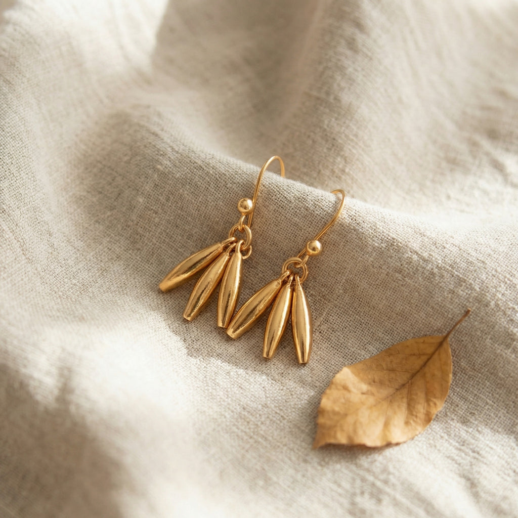 Delicate linear drop earrings in lustrous gold-plated 925 silver, unique handmade jewelry from Bodrum atelier

