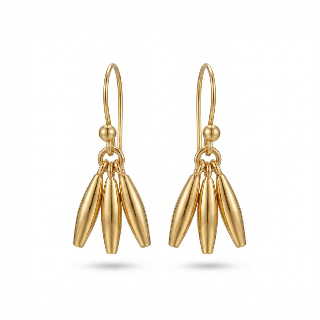 Handcrafted minimalist linear dangle earrings in 925 sterling silver with gold plating, designed by Sultan in Bodrum, Turkey
