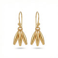 Handcrafted minimalist linear dangle earrings in 925 sterling silver with gold plating, designed by Sultan in Bodrum, Turkey
