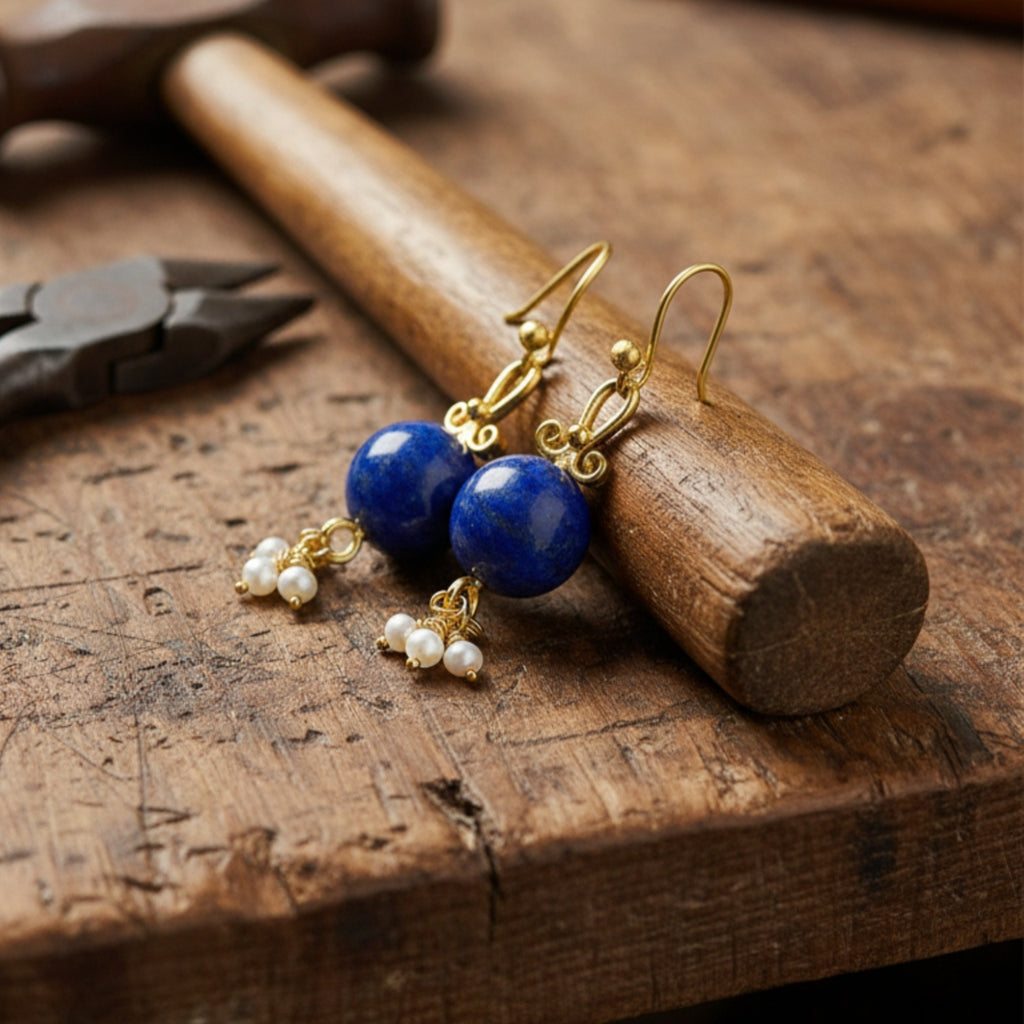 Side view of artisan lapis and pearl drop earrings showing hammered silver texture and ancient Roman inspired design
