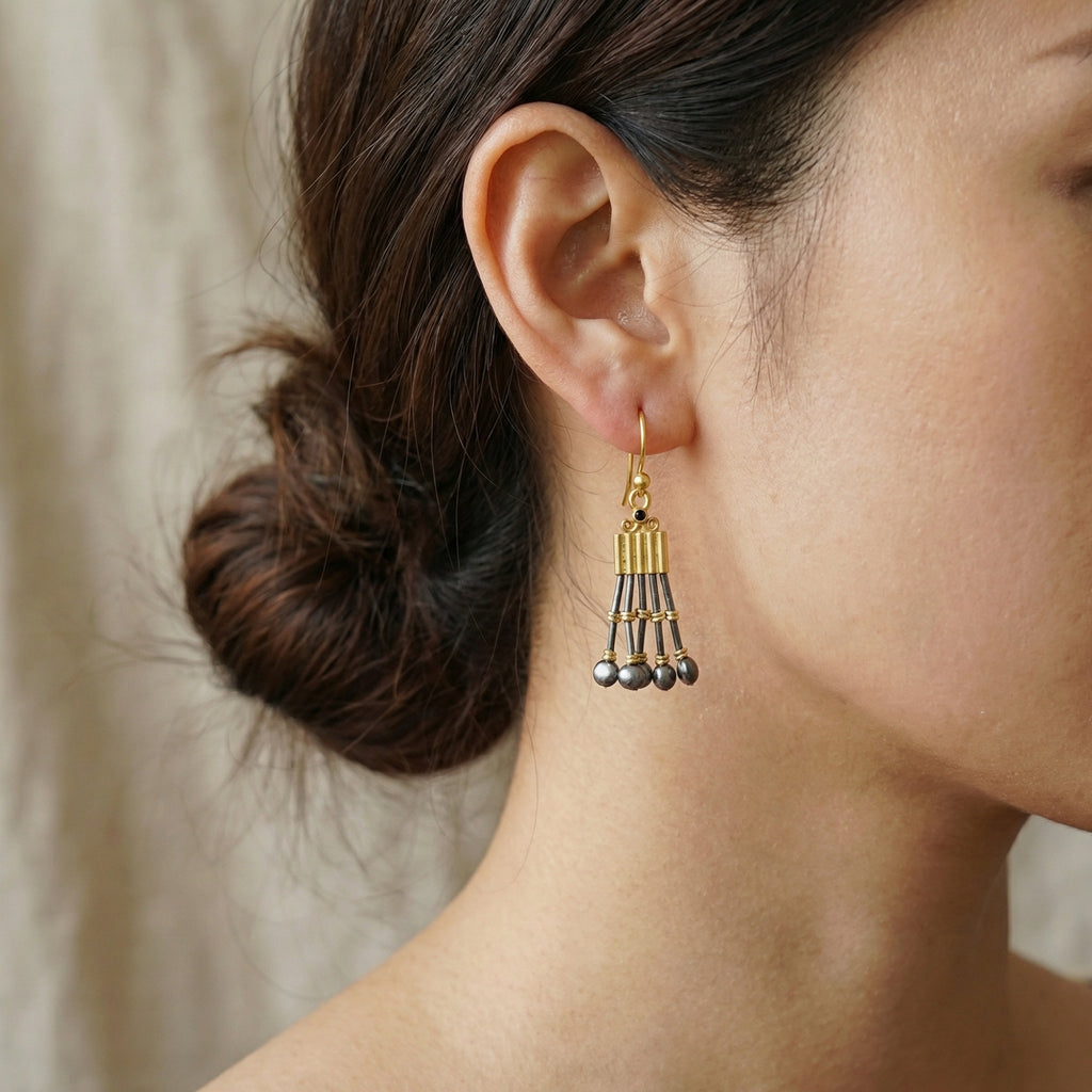 Close-up of black onyx gemstone Troy earrings with oxidized silver beads, handmade designer jewelry from AtelierSultan Bodrum