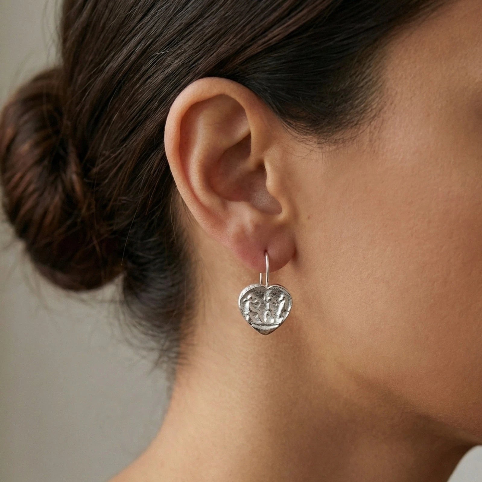 Close-up of heart coin earrings showing ancient-inspired romantic design with heart-shaped coin, 925 silver Turkish jewelry

