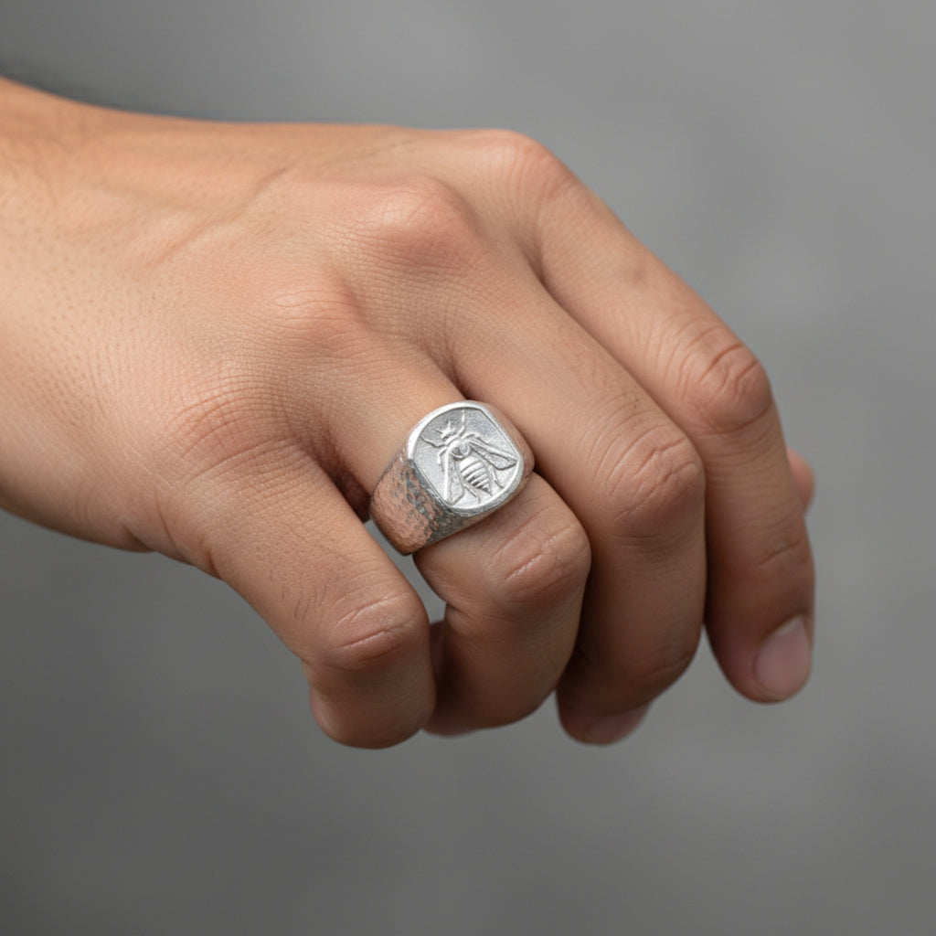 Close-up of Turkish artisan bee coin signet ring showing detailed and hammered texture, handcrafted in Bodrum
