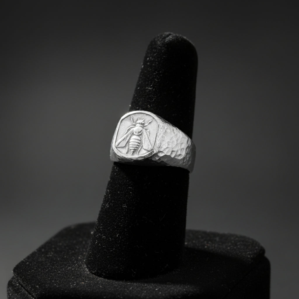 Artisan bee signet ring detail showing hammered texture and on sterling silver, handmade Turkish men's jewelry
