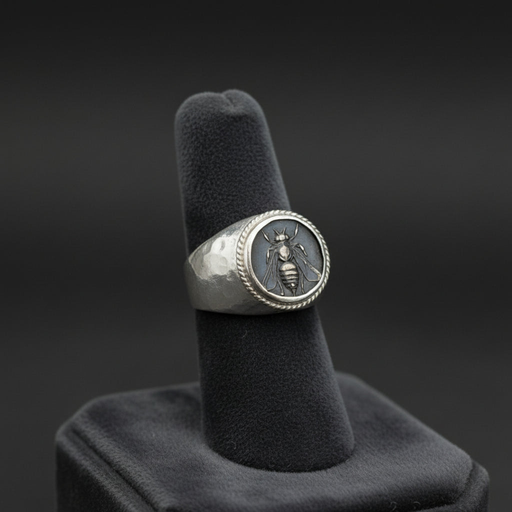 Oxidized silver bee signet ring on hand, 925 silver men's jewelry with ancient motif, perfect gift for men who love unique designer pieces

