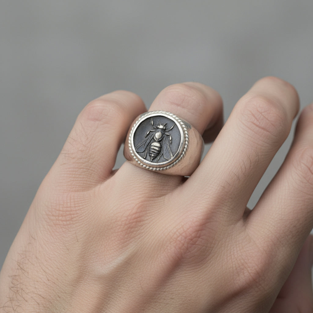 Close-up of Turkish artisan oxidized bee coin signet ring showing detailed blackened finish and hammered texture, handcrafted in Bodrum
