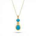 Handmade Arizona turquoise pendant necklace in 925 sterling silver with gold plating, artisan jewelry by Sultan Yilmaz Bodrum featuring natural gemstone
