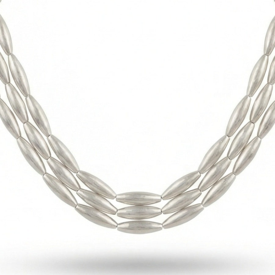 Ancient Troy inspired wheat necklace worn by model, showcasing 48cm length and statement design with gold-plated wheat spacers