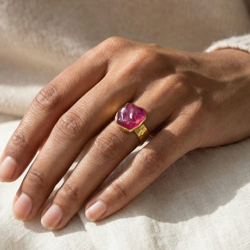 Close-up of Turkish artisan raw ruby stack ring showing detailed 24K gold plating and natural rough stone, handcrafted in Bodrum atelier
