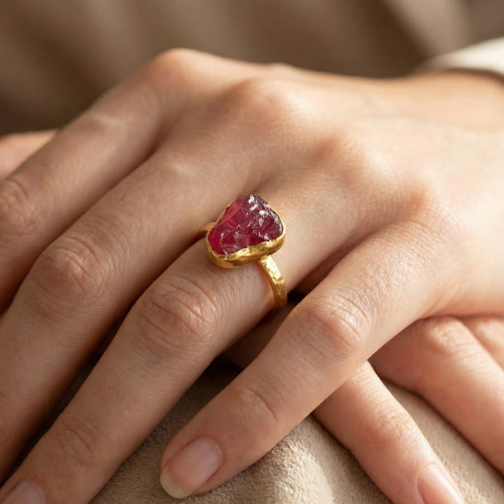 Close-up of Turkish artisan raw ruby stack ring showing detailed 24K gold plating and natural rough stone, handcrafted in Bodrum atelier

