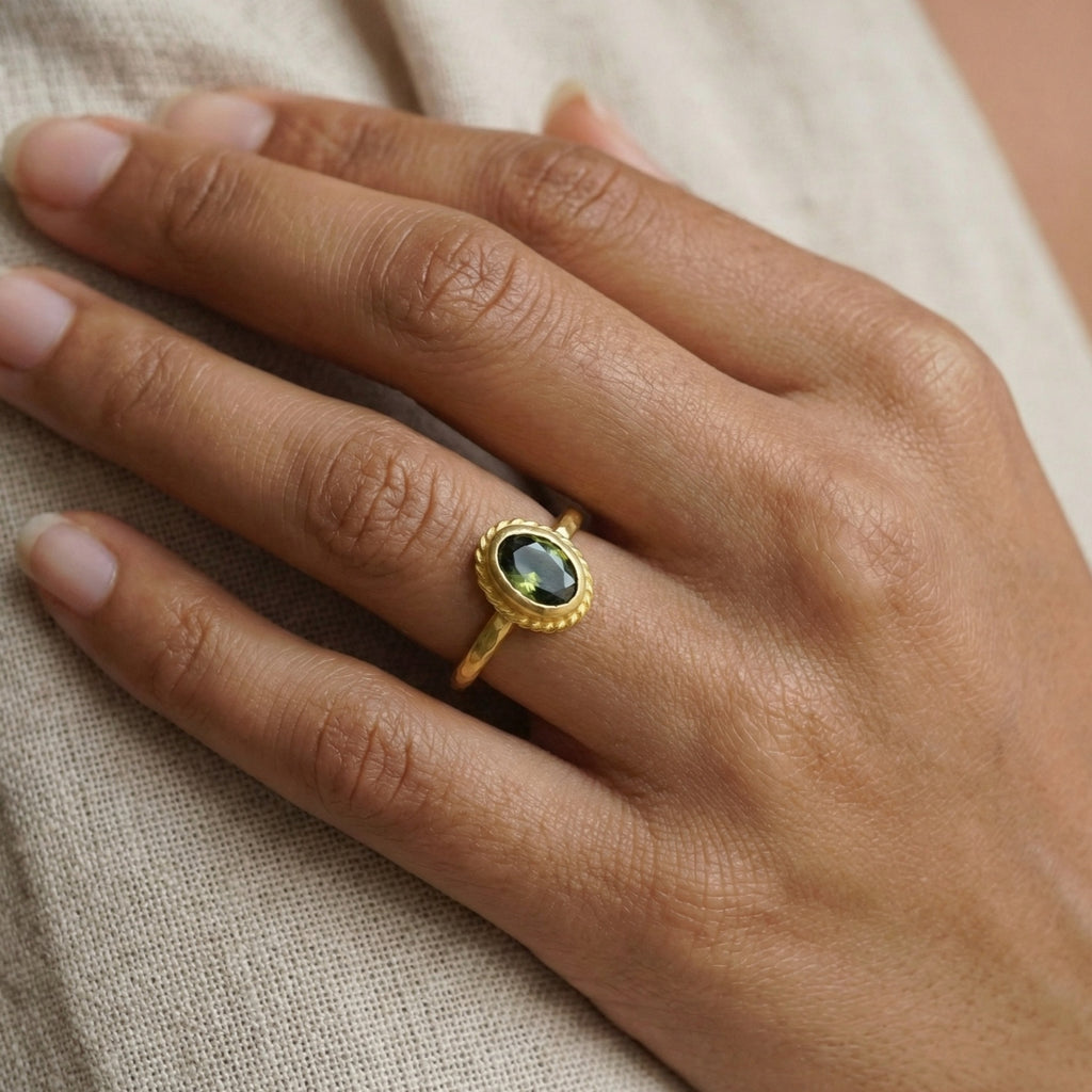 Close-up of Turkish artisan peridot stack ring showing detailed 24K gold plating and natural green gemstone, handcrafted in Bodrum atelier
