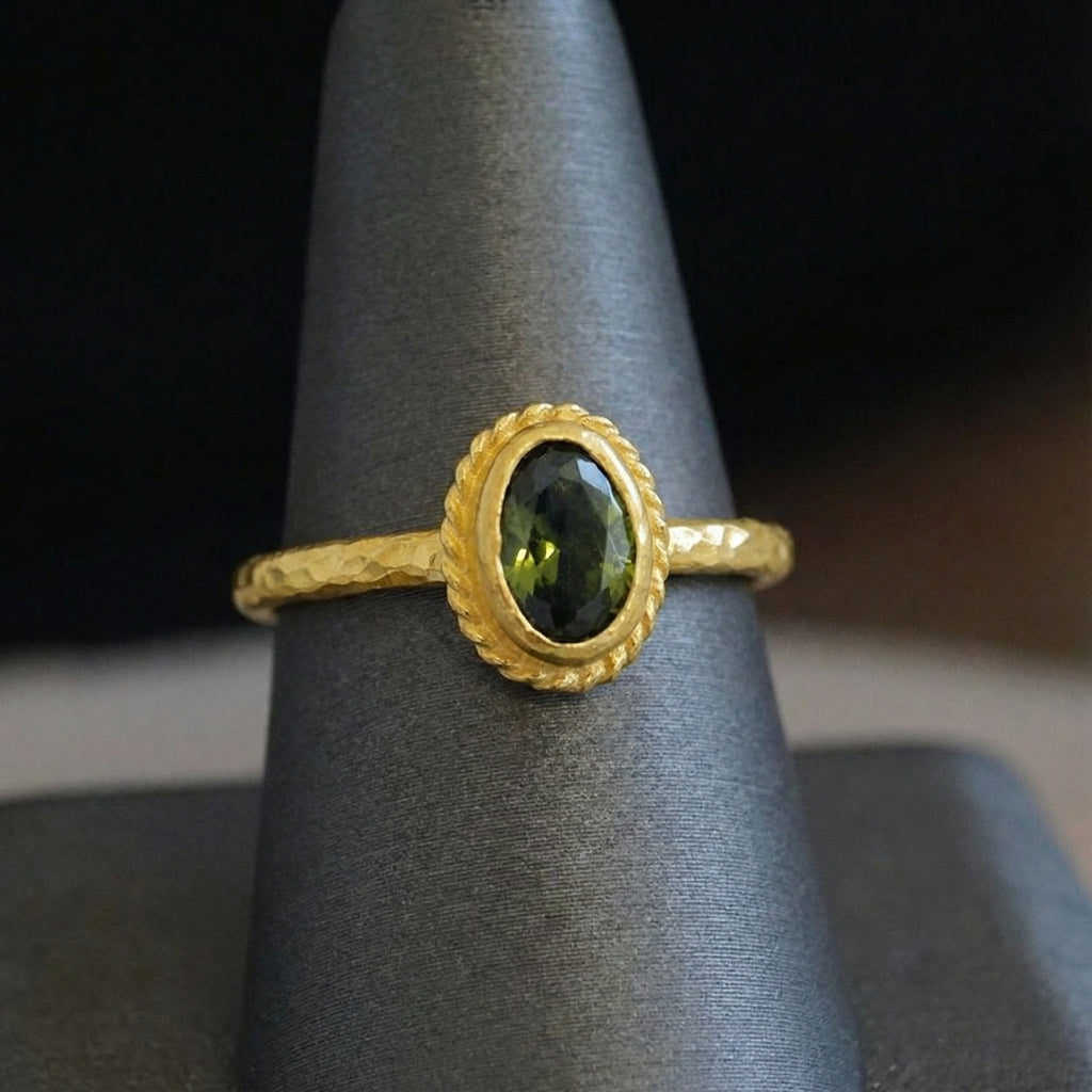 Artisan peridot ring detail showing natural green gemstone with gold plating on sterling silver, handmade Turkish jewelry
