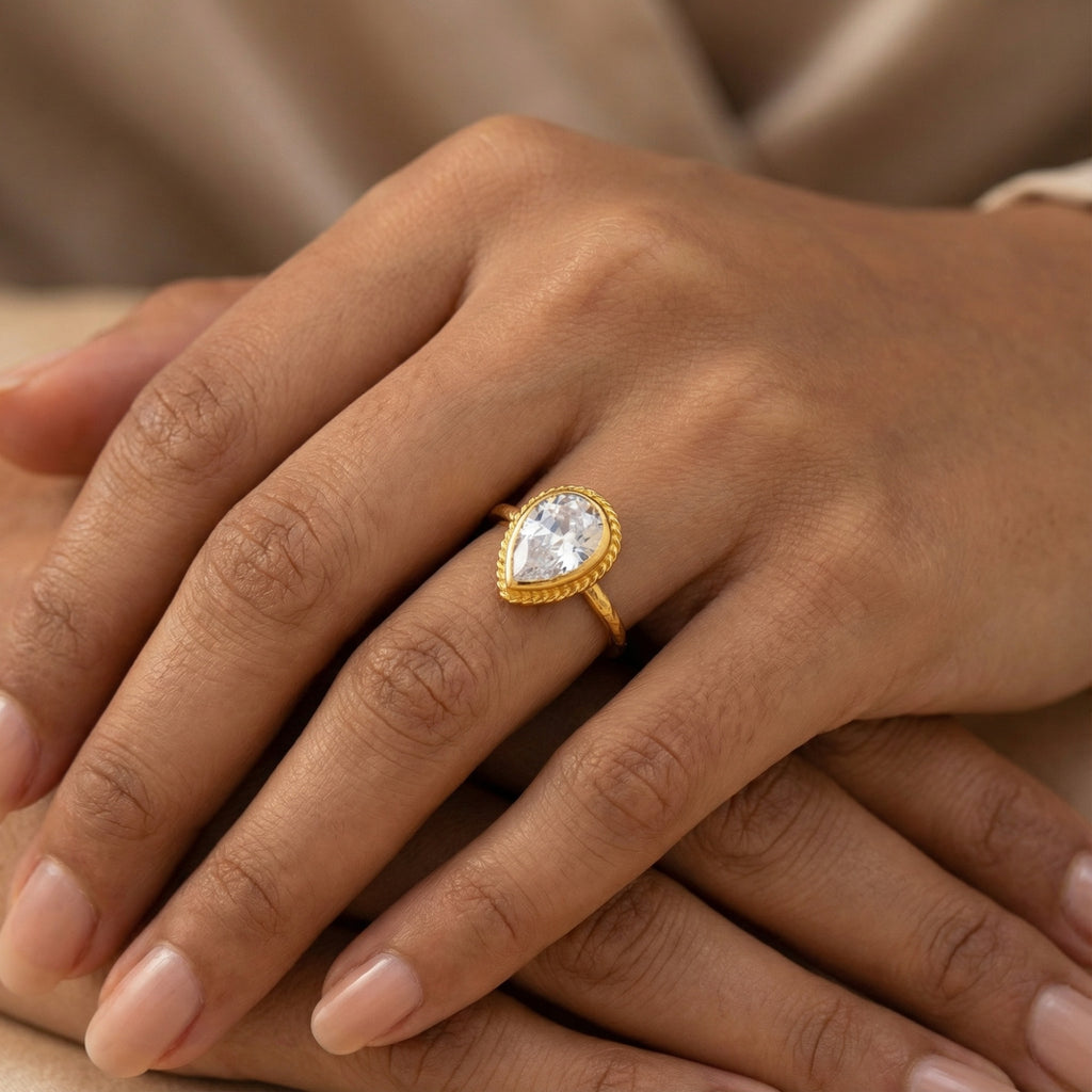 Close-up of Turkish artisan white topaz pear stack ring showing detailed 24K gold plating, handcrafted in Bodrum atelier
