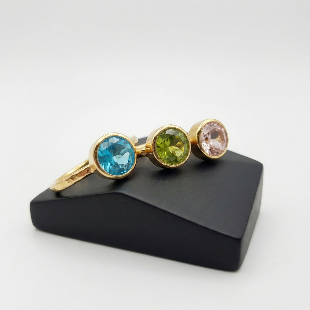 Elegant stackable ring set with natural peridot and peach topaz gemstones, timeless Turkish artisan craftsmanship by Sultan Yılmaz
