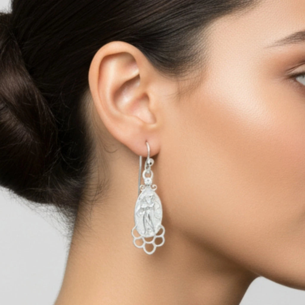 Handmade white topaz coin earrings with sterling silver showing artisan craftsmanship and vintage coin design