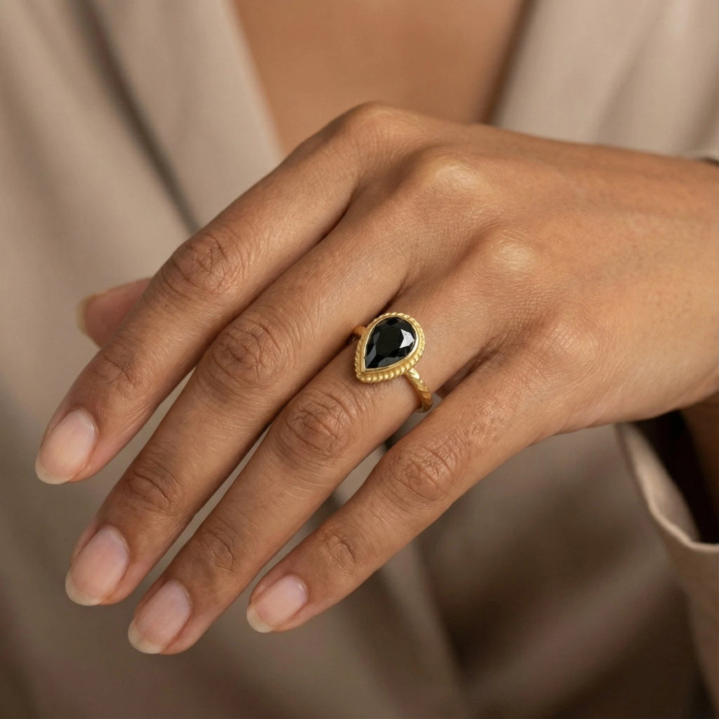Artisan Black Onyx ring with hammered texture, handmade by Sultan in Bodrum, Turkish designer jewelry symbolizing strength with 925 silver