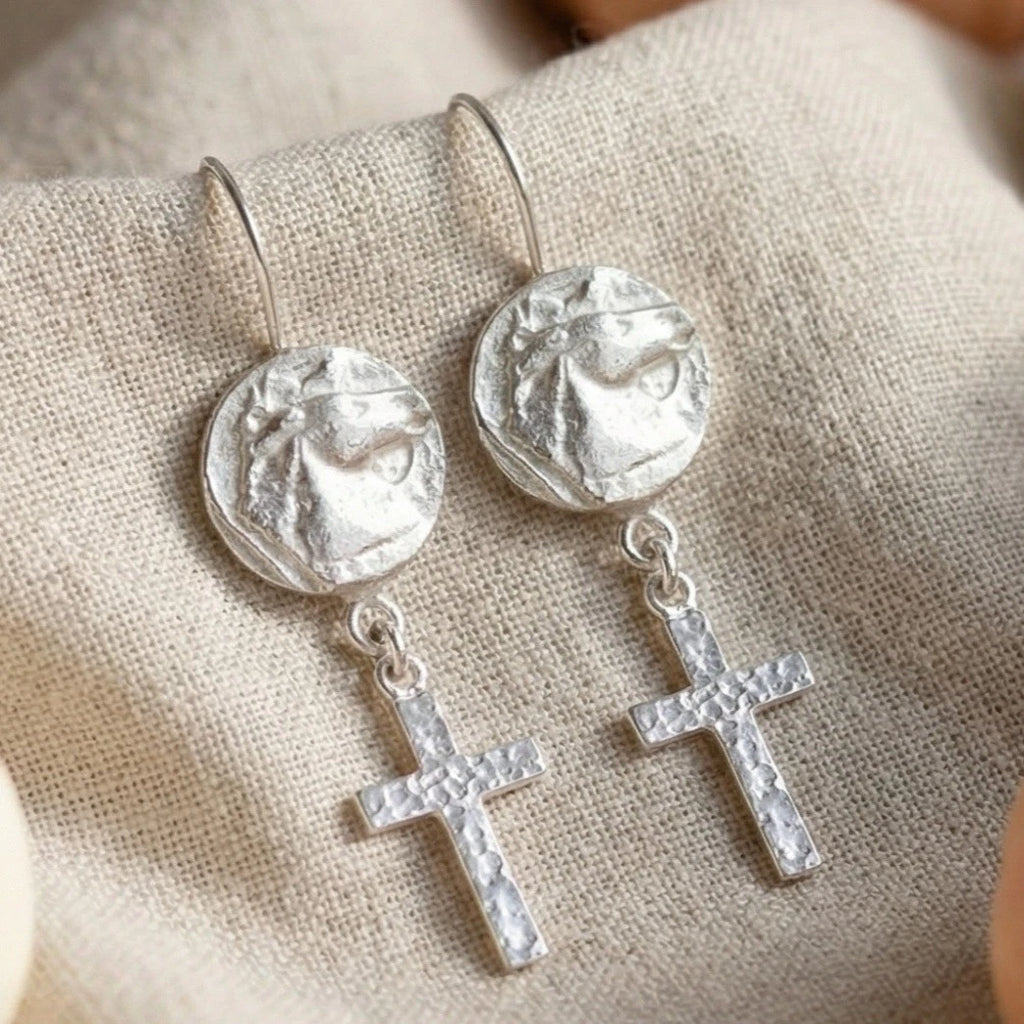 Detailed view of Turkish artisan horse coin earrings with cross design
