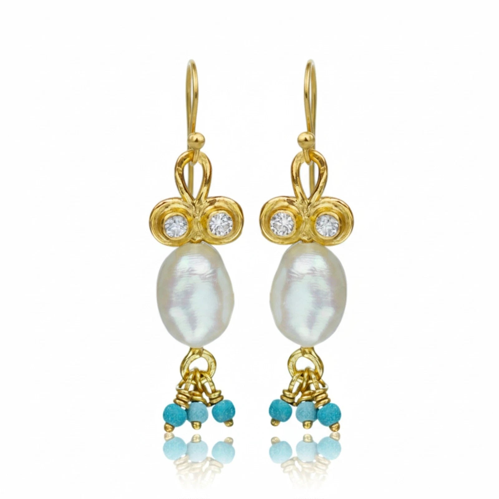 Pearl and Turquoise charm earrings handcrafted by designer Sultan in Bodrum atelier, 925 sterling silver Turkish jewelry symbolizing protection and purity
