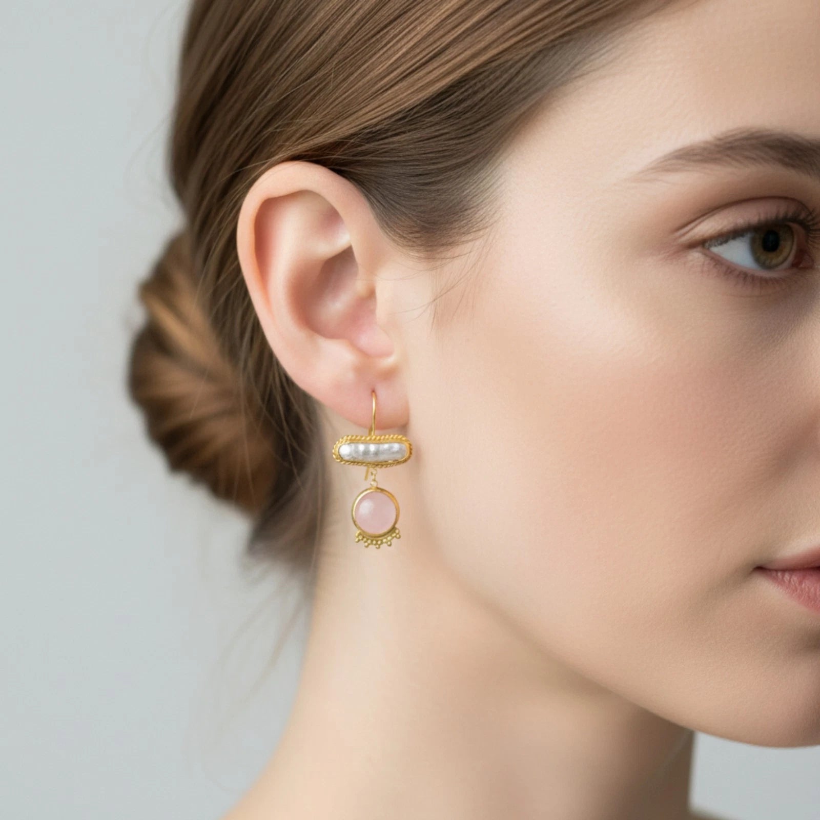 Close-up of pearl and pink quartz gemstone earrings with 24k gold plating option, ancient-inspired Turkish jewelry
