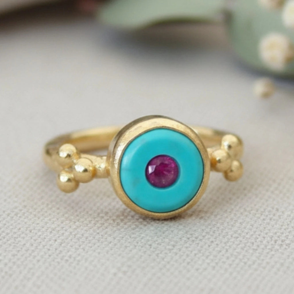 
925 silver Turquoise Ruby ring featuring ancient-inspired design by artisan Sultan, Bodrum Turkish jewelry with protection symbol